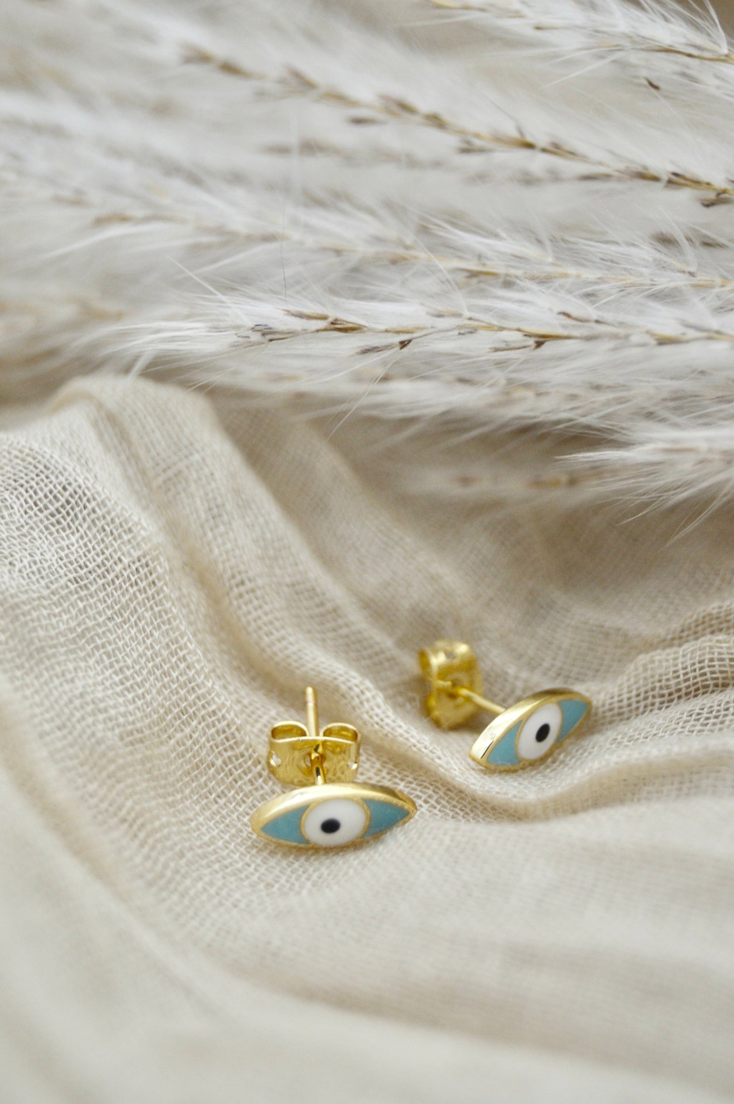 The Ojo Evil Eye Stud Earrings Alma Collective