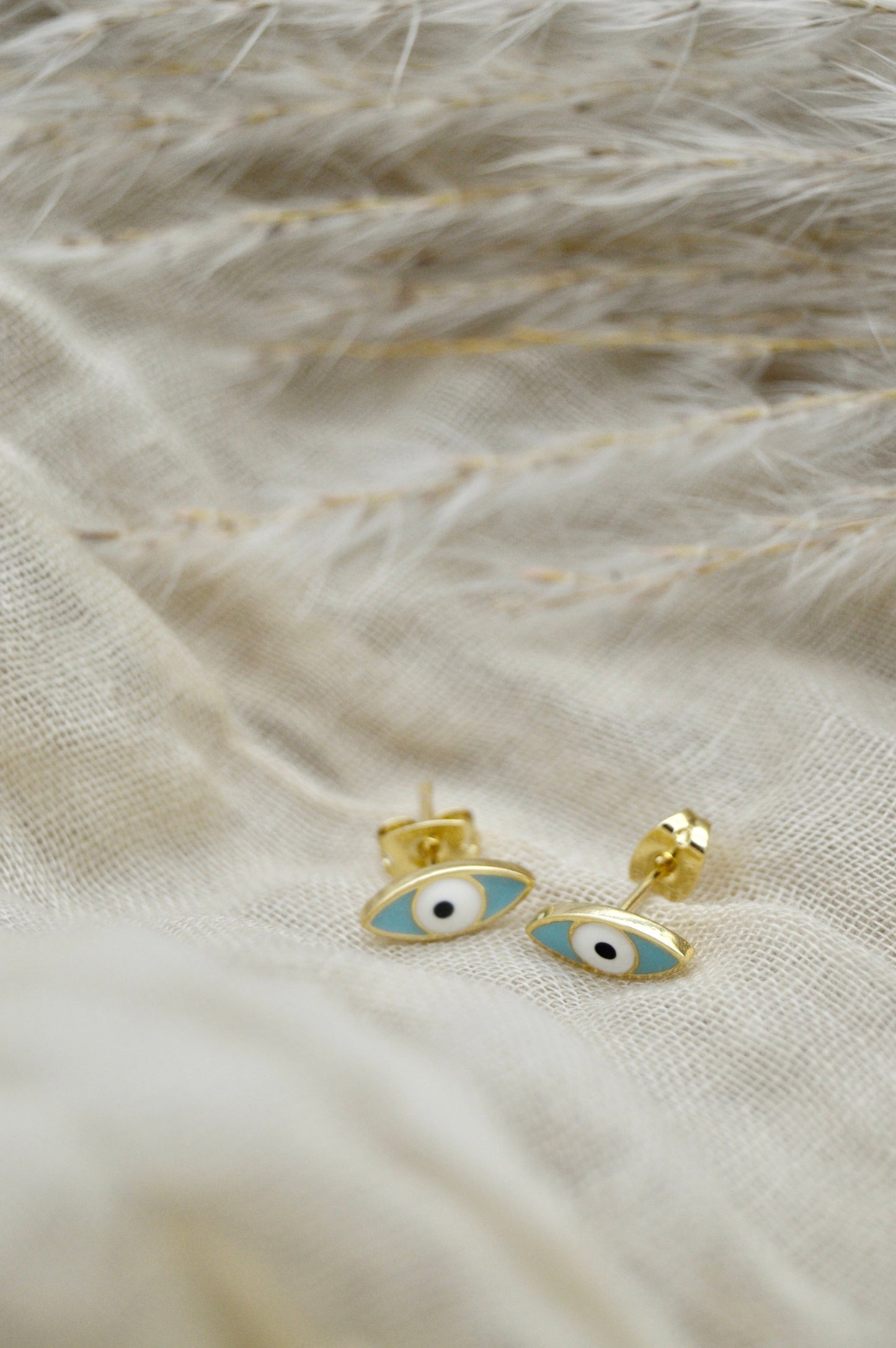 The Ojo Evil Eye Stud Earrings Alma Collective