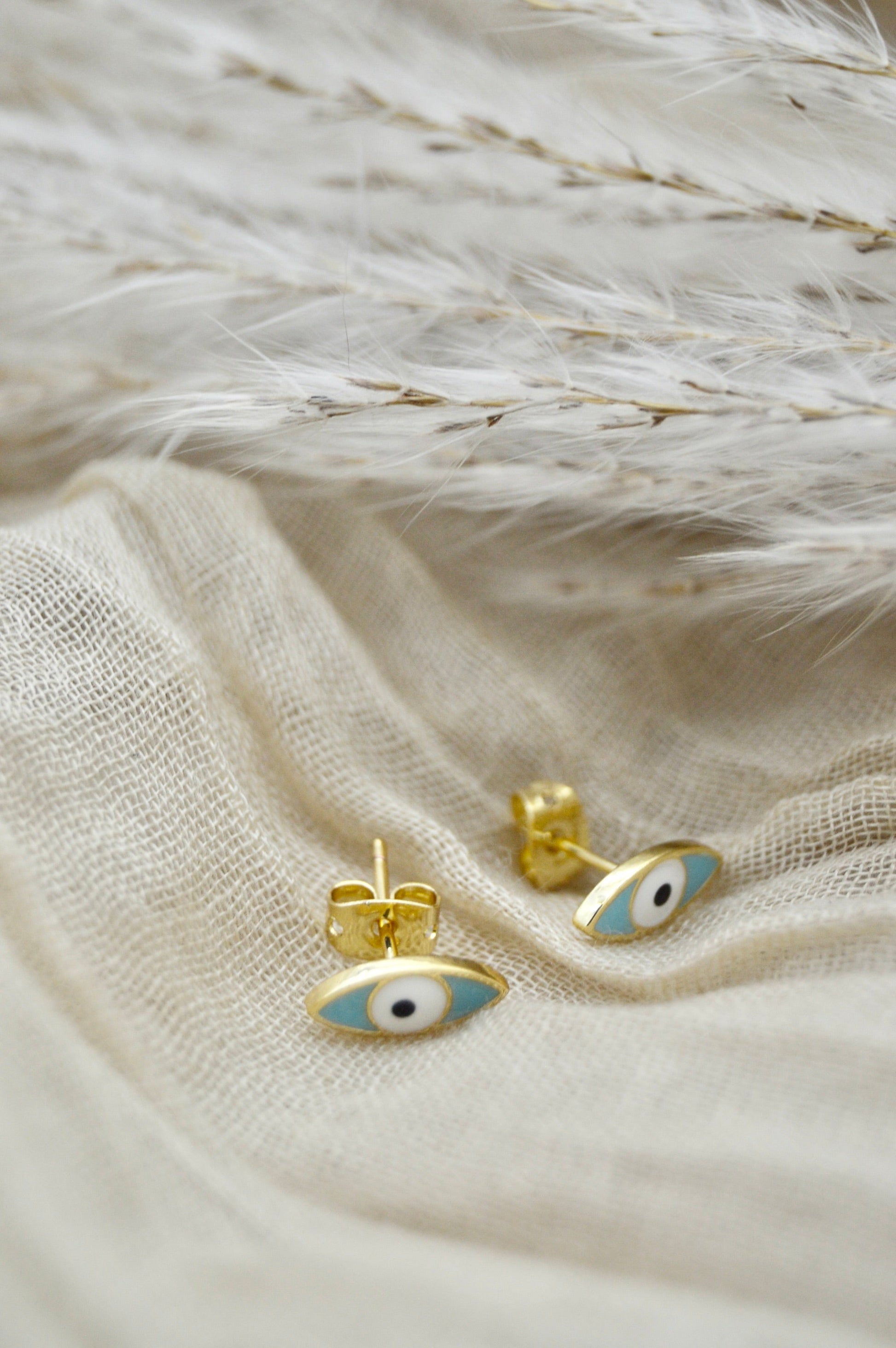 The Ojo Evil Eye Stud Earrings Alma Collective