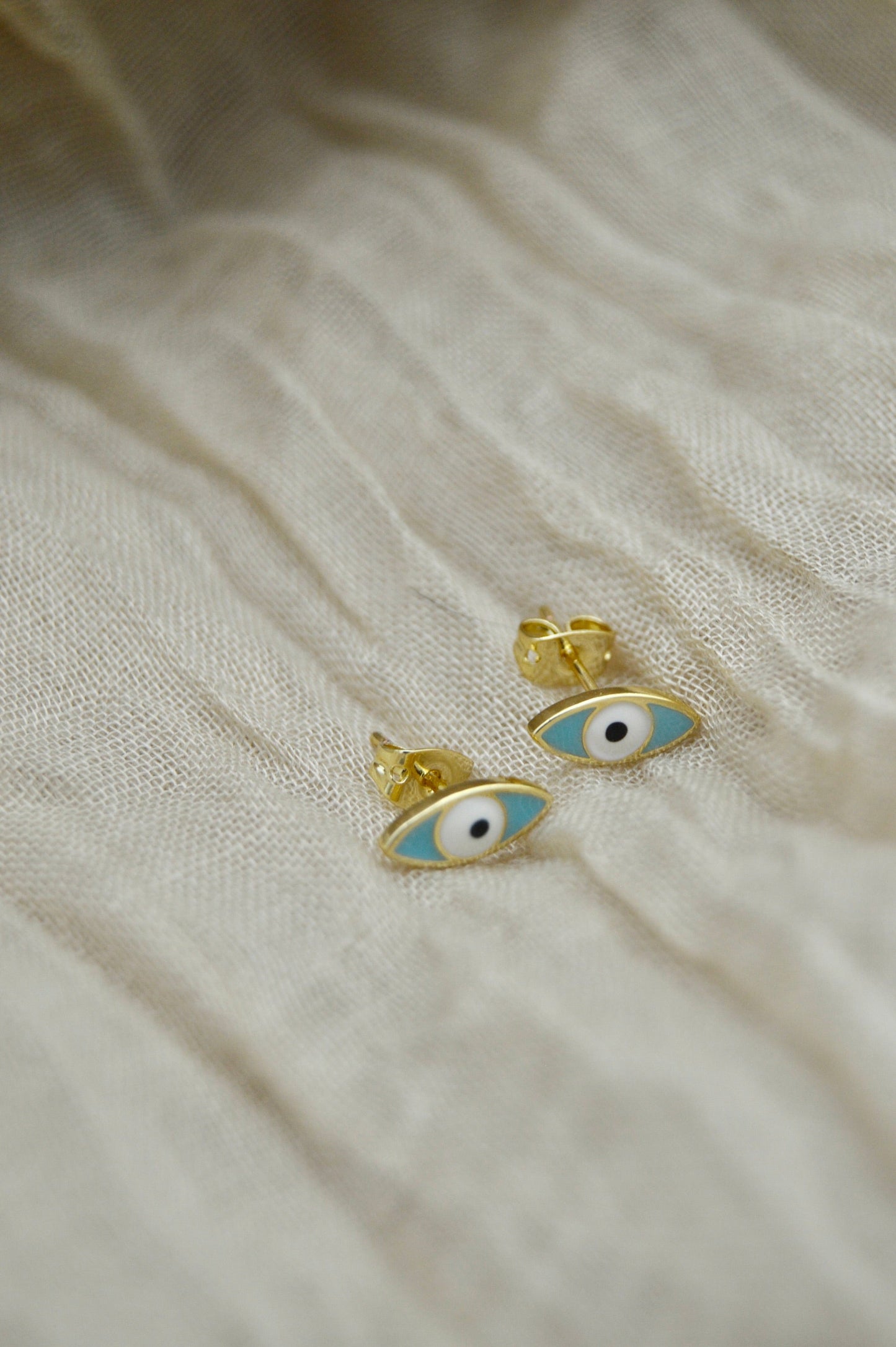 The Ojo Evil Eye Stud Earrings Alma Collective