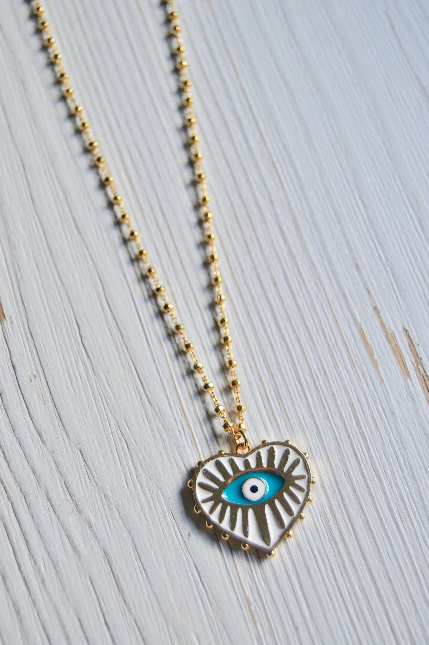 Evil Eye Heart Necklace Flatlay