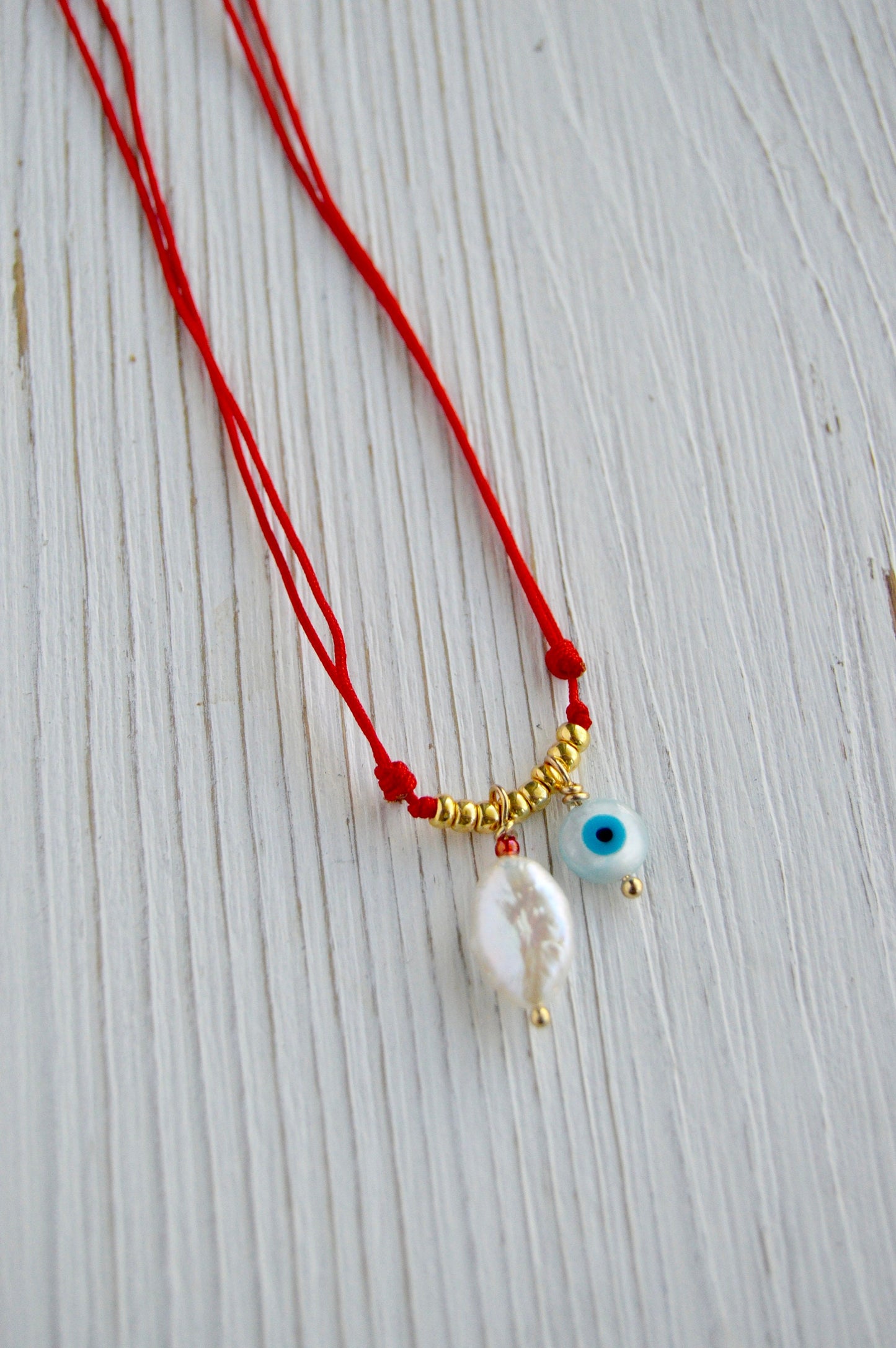 Evil Eye Pearl Necklace Close Up